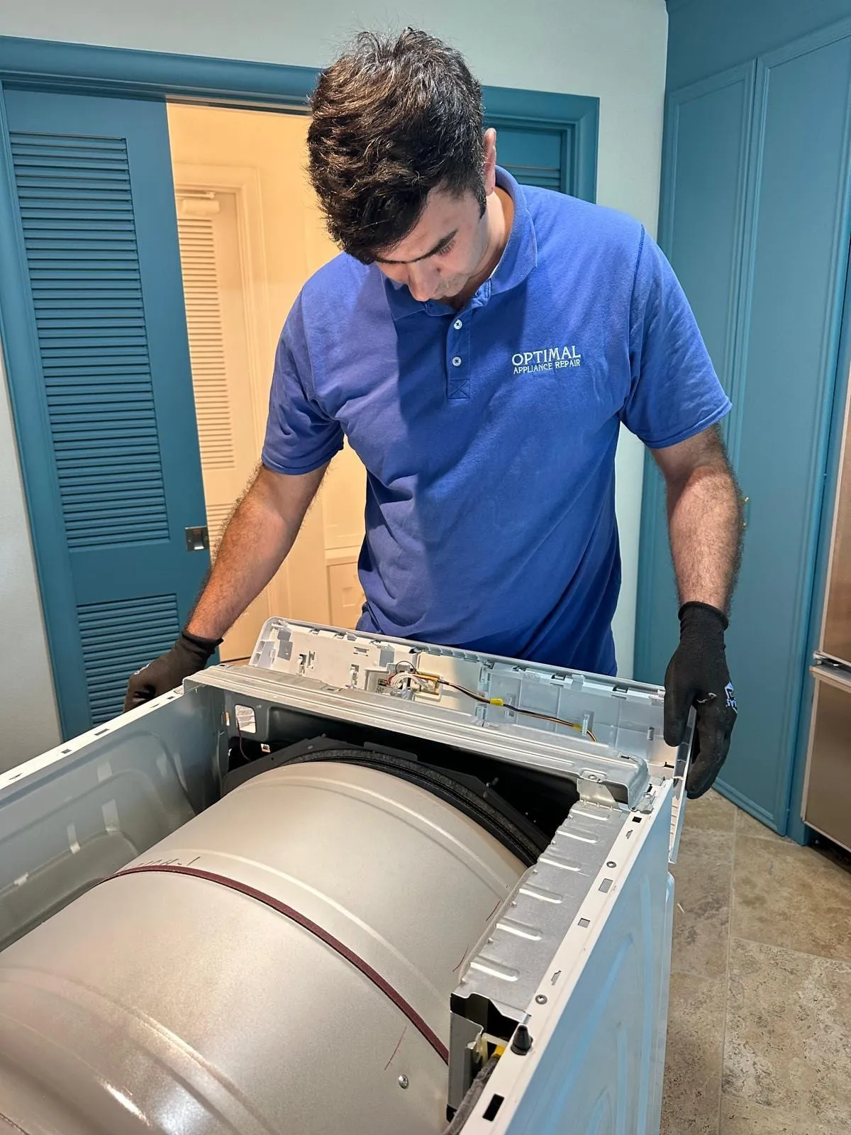 Dryer drum repair, by an Optimal Appliance technician