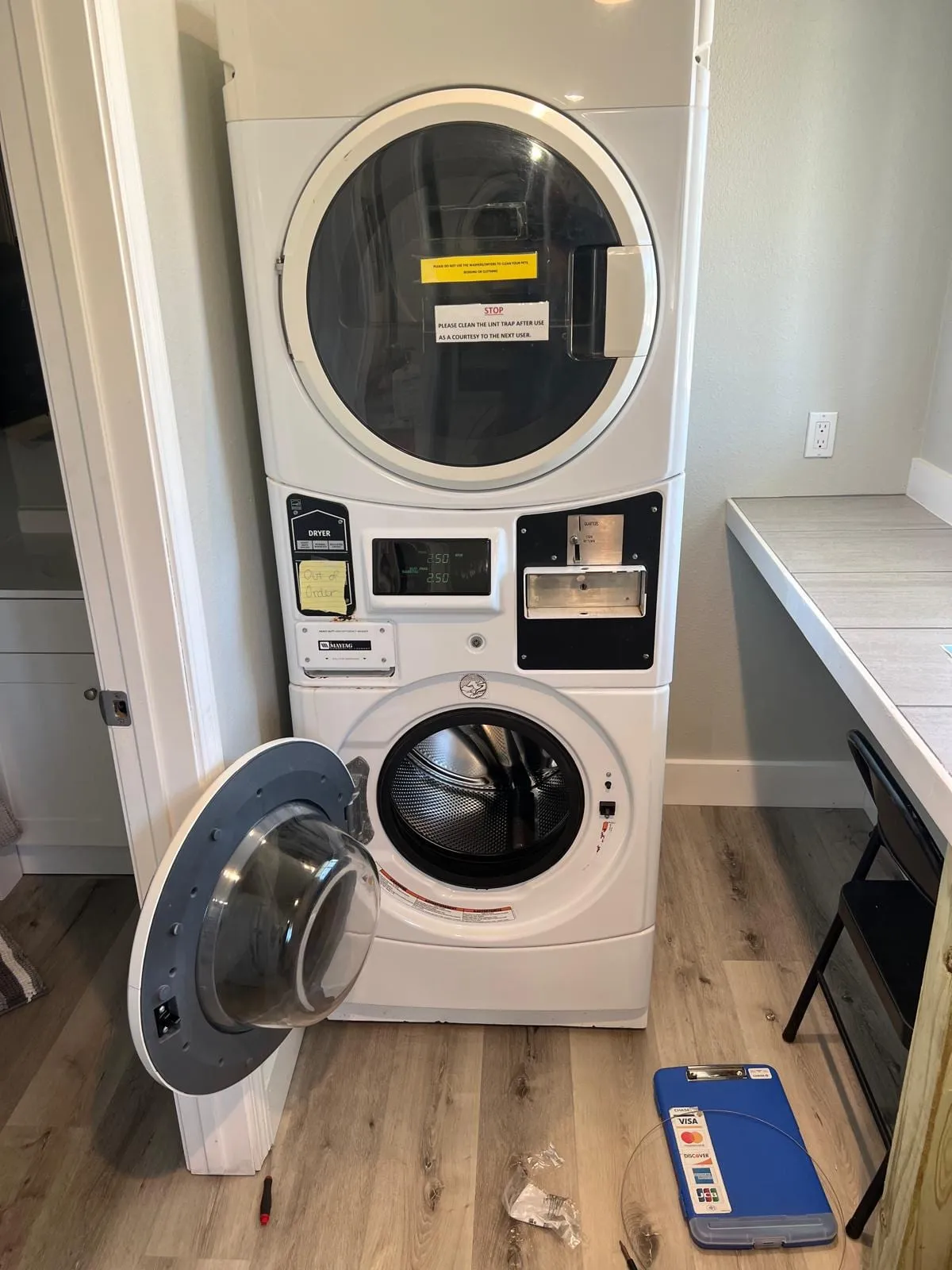 Stacked washer and dryer, by an Optimal Appliance technician